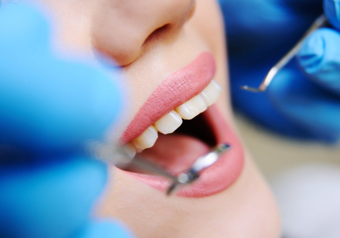beautiful-girl-dental-chair-examination-dentist-min